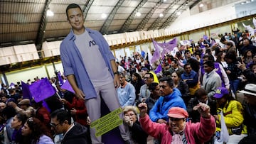 Supporters of Ecuadorian presidential candidate Daniel Noboa hold a cardboard cut-out at a presidential election night gathering in Quito, Ecuador, October 15, 2023. REUTERS/Karen Toro