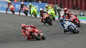 Ducati Lenovo's Spanish rider Marc Marquez (L) leads the pack during the MotoGP Argentina Grand Prix Sprint race at the Termas de Rio Hondo circuit in Santiago del Estero, Argentina on March 15, 2025. (Photo by Luis ROBAYO / AFP)