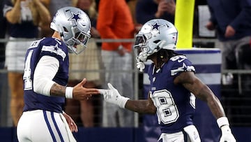 ARLINGTON, TEXAS - DECEMBER 30: CeeDee Lamb #88 of the Dallas Cowboys celebrates with Dak Prescott #4 after scoring a 92 yard touchdown against the Detroit Lions during the first quarter in the game at AT&T Stadium on December 30, 2023 in Arlington, Texas.   Richard Rodriguez/Getty Images/AFP (Photo by Richard Rodriguez / GETTY IMAGES NORTH AMERICA / Getty Images via AFP)