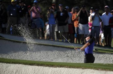 Rory McIlroy of Northern Ireland chips from a bunker during Tuesday practice rounds for the 2017 Masters at Augusta National Golf Course in Augusta, Georgia, U.S.