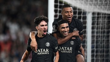 Paris Saint-Germain's Moroccan defender #02 Achraf Hakimi (C) celebrates with Paris Saint-Germain's French forward #07 Kylian Mbappe (R) and Paris Saint-Germain's Portuguese midfielder #17 Vitinha (L) after scoring a goal during the UEFA Champions League 1st round Group F football match between Paris Saint-Germain (PSG) and Borussia Dortmund (BVB) at the Parc des Princes stadium in Paris on September 19, 2023. (Photo by Miguel MEDINA / AFP)