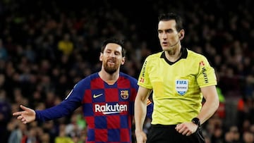 Soccer Football - La Liga Santander - FC Barcelona v Real Sociedad - Camp Nou, Barcelona, Spain - March 7, 2020 Barcelona's Lionel Messi reacts after being shown a yellow card by referee Juan Martinez Munuera REUTERS/Albert Gea