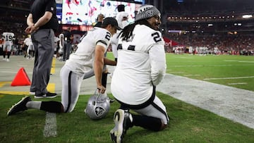 GLENDALE, AZ - AUGUST 12: Running back Marshawn Lynch #24 and kicker Giorgio Tavecchio #2 of the Oakland Raiders kneel on the sidelines during the first half of the NFL game against the Arizona Cardinals at the University of Phoenix Stadium on August 12, 2017 in Glendale, Arizona. The Cardinals defeated the Raiders 20-10.   Christian Petersen/Getty Images/AFP
 == FOR NEWSPAPERS, INTERNET, TELCOS &amp; TELEVISION USE ONLY ==