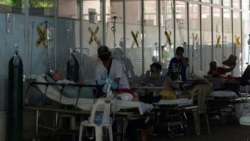 Suspected coronavirus disease (COVID-19) patients lie on hospital beds outside the emergency room of Amang Rodriguez Memorial Medical Center, in Marikina City, Metro Manila, Philippines, April 19, 2021. REUTERS/Lisa Marie David