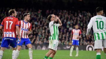 Real Betis' Spanish midfielder #17 Rodri (C) reacts during the Spanish league football match between Real Betis and Girona FC at the Benito Villamarin stadium in Seville on December 21, 2023. (Photo by CRISTINA QUICLER / AFP)