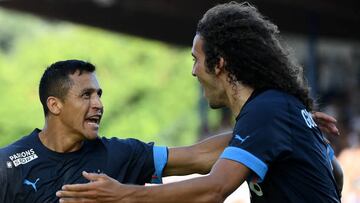 Marseille's Chilean forward Alexis Sanchez (L) celebrates with Marseille's French midfielder Matteo Guendouzi after scoring his team's second goal during the French L1 football match between AJ Auxerre and Olympique Marseille (OM) at Stade de l'Abbe-Deschamps in Auxerre, central France on September 3, 2022. (Photo by FRANCK FIFE / AFP) (Photo by FRANCK FIFE/AFP via Getty Images)
