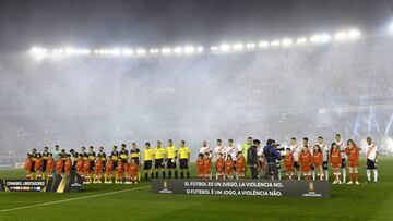 Players of Argentina's Boca Juniors, left, and of Argentina's River Plate line up prior to a Copa Libertadores semifinal first leg soccer match at the Monumental Antonio Vespucio Liberti stadium in Buenos Aires , Argentina, Tuesday, Oct. 1, 2019. (AP Photo/Gustavo Garello)