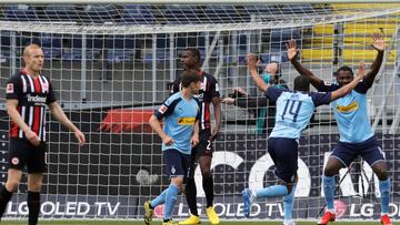 Soccer Football - Bundesliga - Eintracht Frankfurt v Borussia Moenchengladbach - Commerzbank-Arena, Frankfurt, Germany - May 16, 2020 Moenchengladbach's Marcus Thuram celebrates with teammates after scoring their second goal, as play resumes behind c