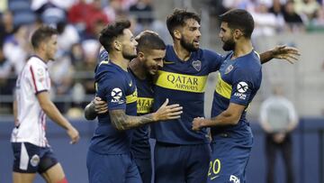 Boca Juniors' Dario Benedetto, center left, is surrounded by teammates after scoring against Chivas during the first half of a Colossus Cup soccer match Saturday, July 6, 2019, in Seattle. (AP Photo/Elaine Thompson)