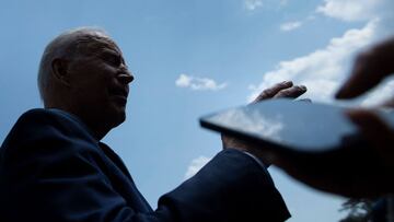 US President Joe Biden talks to reporters while walking to Marine One on the South Lawn of the White House July 16, 2021, in Washington, DC. (Photo by Brendan Smialowski / AFP)