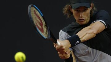 Chile's Nicolas Jarry returns the ball to Argentina's Diego Schwartzman at the semifinal of the Rio Open tennis tournament in Rio de Janeiro, Brazil, Saturday, Feb. 24, 2018. (AP Photo/Leo Correa)