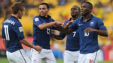 France's Gilles Sunu (R)celebrates with teammates Antoine Griezmann (L), Francis Coquelin (C) and Gael Kakuta after scoring against South Korea during the U-20 World Cup Group A first round football match held at the Nemesio Camacho "El Campin" stadium in Bogota, Colombia, on August 02, 2011. AFP PHOTO/Eitan Abramovich
