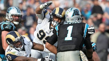 LOS ANGELES, CA - NOVEMBER 06: Dominique Easley #91 and Aaron Donald #99 of the Los Angeles Rams reaches for quarterback Cam Newton #1 of the Carolina Panthers during the third quarter of the game at the Los Angeles Coliseum on November 6, 2016 in Los Angeles, California.   Stephen Dunn/Getty Images/AFP
 == FOR NEWSPAPERS, INTERNET, TELCOS &amp; TELEVISION USE ONLY ==