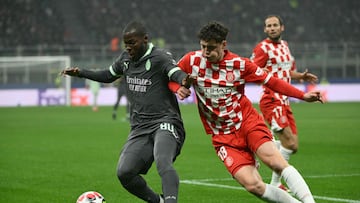 AC Milan's American midfielder #80 Yunus Musah fights for the ball with Girona's Czech defender #18 Ladislav Krejci during the UEFA Champions League football match between AC Milan and Girona at San Siro stadium in Milan, on January 22, 2025. (Photo by Alberto PIZZOLI / AFP)
