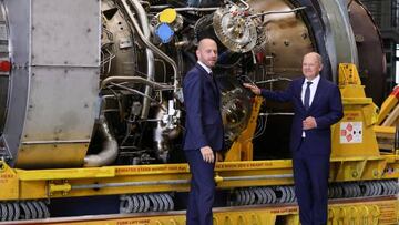 MUELHEIM AN DER RUHR, GERMANY - AUGUST 03: German Chancellor Olaf Scholz (R) and Siemens Energy Chairman Christian Bruch look at the Siemens gas turbine intended for the Nord Stream 1 gas pipeline in Russia at a Siemens Energy facility on August 03, 2022 in Muelheim an der Ruhr, Germany. The turbine underwent maintenance in Canada and was supposed to already be delivered to Russia for installation back into the pipeline, but Russian energy company Gazprom has so far refused to accept the repaired turbine, citing insufficient documentation. German authorities have refuted Gazprom's claim and say the Russian government is stalling. Russia is still supplying gas to Germany via Nord Stream 1, albeit at a much reduced flow. The two countries are at odds over the ongoing Russian war in Ukraine. (Photo by Andreas Rentz/Getty Images)