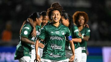 Deportivo Cali's midfielder #20 Paola Garcia celebrates after scoring her penalty kick and her team's second goal during the 2025 Women's Copa Libertadores quarter-final football match between Colombia's Deportivo Cali and Brazil's Sao Paulo at the Florencio Sola Stadium in Banfield, Buenos Aires province on October 12, 2025. (Photo by Luis ROBAYO / AFP)