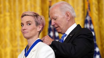 U.S. President Joe Biden awards the Presidential Medal of Freedom to U.S. Women's National Soccer Team player soccer player Megan Rapinoe during a ceremony at the White House in Washington, U.S., July 7, 2022. REUTERS/Kevin Lamarque