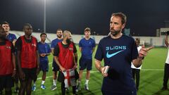 DOHA, QATAR - NOVEMBER 17: England Manager Gareth Southgate speaks with migrant workers at Al Wakrah Stadium on November 17, 2022 in Doha, Qatar. (Photo by Eddie Keogh - The FA/The FA via Getty Images)