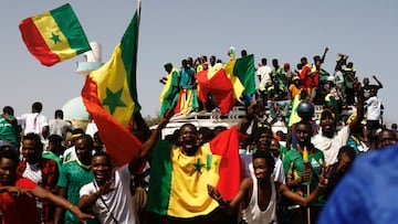 Senegalese fans celebrate as they wait to welcome the Senegal National Soccer Team after their Africa Cup win, in Dakar, Senegal February 7, 2022. REUTERS/ Zohra Bensemra