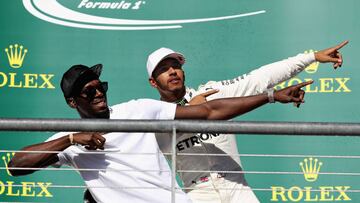 Hamilton y Bolt en el podio