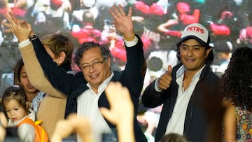 FILE - Presidential candidate Gustavo Petro, center, waves to supporters alongside his son Nicolas Petro Burgos, right, on election night in Bogota, Colombia, Sunday, May 29, 2022. Colombian police arrested Petro’s son Saturday, July 29, 2023, as part of a high-profile money laundering probe into funds he allegedly collected from convicted drug traffickers during last year’s presidential campaign. (AP Photo/Fernando Vergara, File)