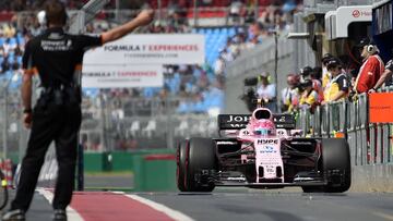 Force India's French driver Esteban Ocon enters the pitlane during the first practice session for the Formula One Australian Grand Prix in Melbourne on March 24, 2017. / AFP PHOTO / SAEED KHAN / -- IMAGE RESTRICTED TO EDITORIAL USE - STRICTLY NO COMMERCIAL USE --