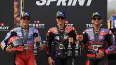 Winner Aprilia Spanish rider Maverick Vinales (C), second-placed Ducati Spanish rider Marc Marquez and third-placed Ducati Spanish rider Jorge Martin pose for pictures after the MotoGP sprint race of the Portuguese Grand Prix at the Algarve International Circuit in Portimao on March 23, 2024. (Photo by PATRICIA DE MELO MOREIRA / AFP)