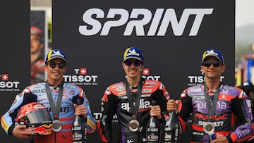 Winner Aprilia Spanish rider Maverick Vinales (C), second-placed Ducati Spanish rider Marc Marquez and third-placed Ducati Spanish rider Jorge Martin pose for pictures after the MotoGP sprint race of the Portuguese Grand Prix at the Algarve International Circuit in Portimao on March 23, 2024. (Photo by PATRICIA DE MELO MOREIRA / AFP)