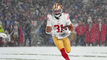 Dec 1, 2024; Orchard Park, New York, USA; San Francisco 49ers running back Isaac Guerendo (31) runs with the ball for a touchdown against the Buffalo Bills during the second half at Highmark Stadium. Mandatory Credit: Gregory Fisher-Imagn Images