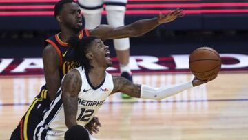 Memphis Grizzlies&#039; Ja Morant (12) shoots against Golden State Warriors&#039; Andrew Wiggins during the second half of an NBA basketball Western Conference play-in game in San Francisco, Friday, May 21, 2021. (AP Photo/Jed Jacobsohn)