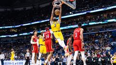 Mar 14, 2023; New Orleans, Louisiana, USA; Los Angeles Lakers forward Anthony Davis (3) dunks the ball against New Orleans Pelicans forward Brandon Ingram (14) during the second half at Smoothie King Center. Mandatory Credit: Stephen Lew-USA TODAY Sports