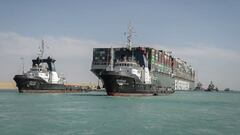 29 March 2021, Egypt, Suez: The &quot;Ever Given&quot; container ship operated by the Evergreen Marine Corporation, sails with tugboats through the Suez Canal, after it was fully freed and floated.