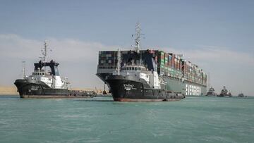 29 March 2021, Egypt, Suez: The &quot;Ever Given&quot; container ship operated by the Evergreen Marine Corporation, sails with tugboats through the Suez Canal, after it was fully freed and floated.