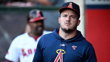 ANAHEIM, CALIFORNIA - AUGUST 01: Mike Trout #27 of the Los Angeles Angels looks on from the dugout during the first inning against the Colorado Rockies at Angel Stadium of Anaheim on August 01, 2024 in Anaheim, California. Orlando Ramirez/Getty Images/AFP (Photo by Orlando Ramirez / GETTY IMAGES NORTH AMERICA / Getty Images via AFP)