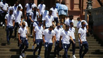 Gimnasia y Esgrima soccer team players leave the presidential palace after paying last respects to their coach Diego Maradona, in Buenos Aires, Argentina, Thursday, Nov. 26, 2020. The Argentine soccer great who was among the best players ever and who led his country to the 1986 World Cup title died from a heart attack at his home Wednesday at the age of 60. (AP Photo/Marcos Brindicci)