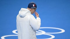 Why do swimmers wear a coat before competing in the swimming pool?