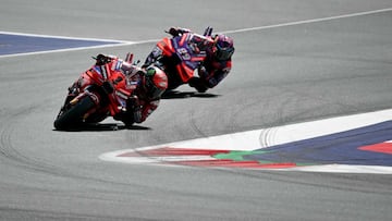 Ducati Lenovo Team's Italian rider Francesco Bagnaia (L) and Prima Pramac Racing's Spanish rider Jorge Martin compete in the Austrian MotoGP race at the Red Bull Ring in Spielberg, Austria on August 18, 2024. (Photo by Jure Makovec / AFP)