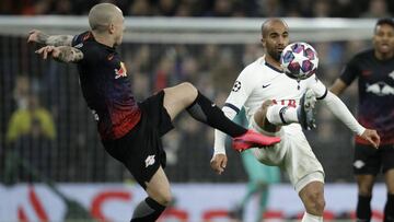 Tottenham's Lucas Moura, right, is challenged by Leipzig's Angelino during a first leg, round of 16, Champions League soccer match between Tottenham Hotspur and Leipzig at the Tottenham Hotspur Stadium in London, England, Wednesday Feb. 19, 2020