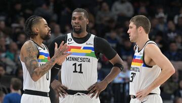 Feb 3, 2023; Minneapolis, Minnesota, USA; Minnesota Timberwolves guard D'Angelo Russell (0) and center Naz Reid (11) and forward Matt Ryan (37) talk during the third quarter against the Orlando Magic at Target Center. Mandatory Credit: Jeffrey Becker-USA TODAY Sports