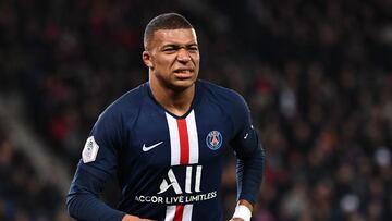Paris Saint-Germain's French forward Kylian Mbappe reacts after an injury during the French L1 football match between Paris Saint-Germain and AS Monaco at the Parc des Princes stadium in Paris on January 12, 2020. (Photo by Anne-Christine POUJOULAT /
