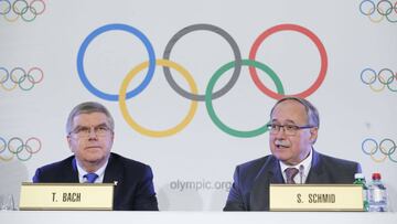 Samuel Schmid, Chair of the IOC Disciplinary Commission, and Thomas Bach, President of the International Olympic Committee, attend a news conference after an Executive Board meeting on sanctions for Russian athletes, in Lausanne, Switzerland, December 5, 