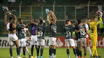 Colombia's Deportivo Cali players celebrate at the end of the Copa Libertadores group stage football match against Bolivia's Always Ready, at the Deportivo Cali stadium in Las Palmeras, Colombia, on May 19, 2022. (Photo by Raul ARBOLEDA / AFP)