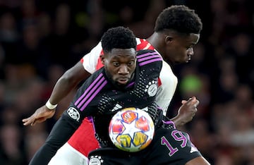 Arsenal's Bukayo Saka battles against Alphonso Davies of Bayern during the UEFA Champions League quarter-finals in April 2024.