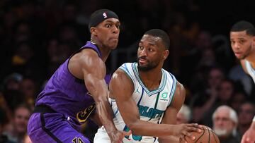 Mar 29, 2019; Los Angeles, CA, USA; Charlotte Hornets guard Kemba Walker (15) looks to pass the ball as Los Angeles Lakers guard Rajon Rondo (9) defends in the second half of the game at Staples Center. Mandatory Credit: Jayne Kamin-Oncea-USA TODAY Sports