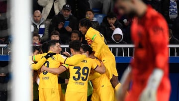 Barcelona players celebrate their second goal scored by Barcelona's German midfielder #22 Ilkay Gundogan during the Spanish league football match between Deportivo Alaves and FC Barcelona at the Mendizorroza stadium in Vitoria on February 3, 2024. (Photo by Ander Gillenea / AFP)