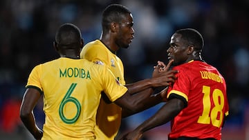 South Africa's midfielder #13 Sphephelo Yaya Sithole (2nd L) argues with Angola's forward #18 Zito Luvumbo (R) during the Africa Cup of Nations (CAN) Group B football match between South Africa and Angola at Marrakesh Stadium in Marrakesh, Morocco on December 22, 2025. (Photo by Khaled DESOUKI / AFP)