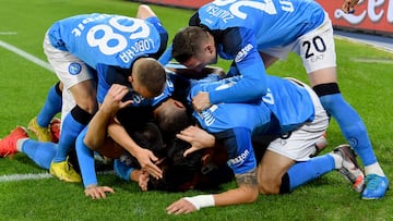 Napoli's Kosovan defender Amir Rrahmani celebrates with team mates after scoring a goal during the Italian Serie A football match between Napoli and Juventus at the Diego-Maradona stadium in Naples on January 13, 2023. (Photo by Alberto PIZZOLI / AFP)