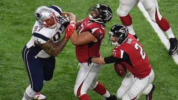 Feb 5, 2017; Houston, TX, USA; Atlanta Falcons quarterback Matt Ryan (2) scrabbles as New England Patriots defensive end Alan Branch (97) pressures him  in the first quarter during Super Bowl LI at NRG Stadium. Blocking is Atlanta Falcons center Alex Mack (51). Mandatory Credit: Richard Mackson-USA TODAY Sports