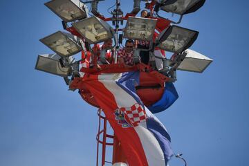 Croatian workers prepare a giant flag on the top of an airport tower at the Zagreb International Airport, in tribute to Croatian national football team, after reaching the final at the Russia 2018 World Cup, on July 16, 2018, in Zagreb. / AFP PHOTO / ATTI