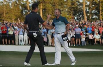 Justin Rose congratulates Sergio Garcia.